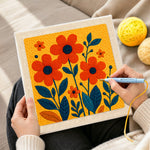 Creating handmade vibrant orange florals punch needle artwork