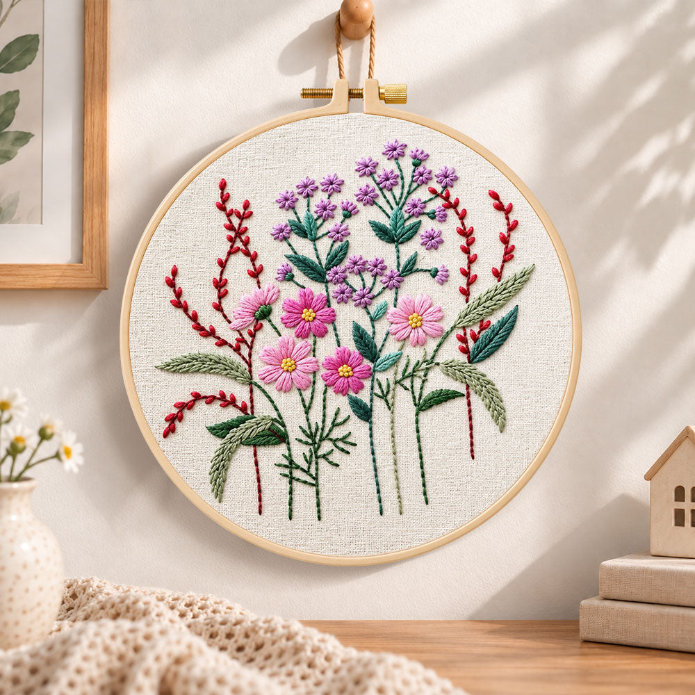 Vibrant purple floral embroidery hoop wall art displayed as warm and cozy handmade home decor
