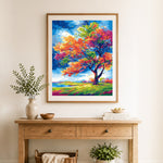 Finished vibrant rainbow foliage cross stitch artwork displayed as home decor