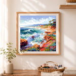 Finished vibrant rocky seaside cliffs cross stitch artwork displayed as home decor
