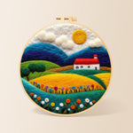 Vibrant rural fields needle felting kit for beginners with a round wooden frame