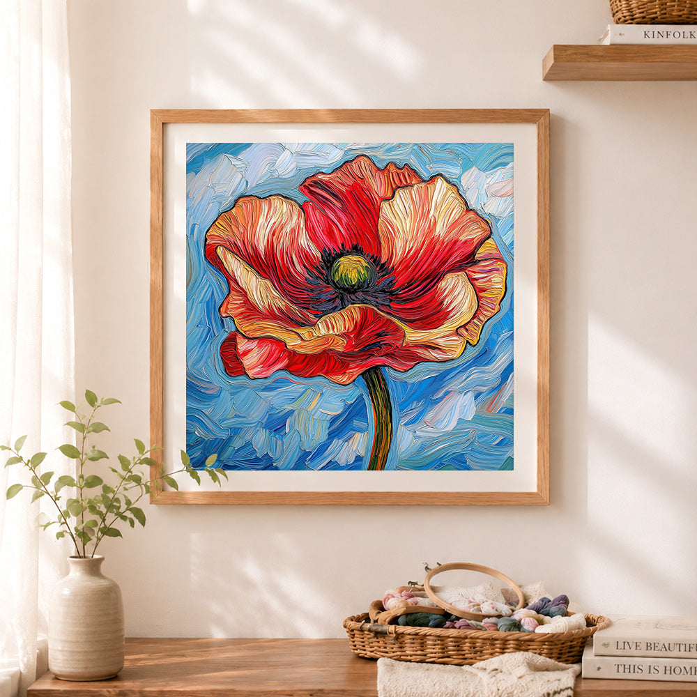 Finished vibrant swirling red poppy cross stitch artwork displayed as home decor