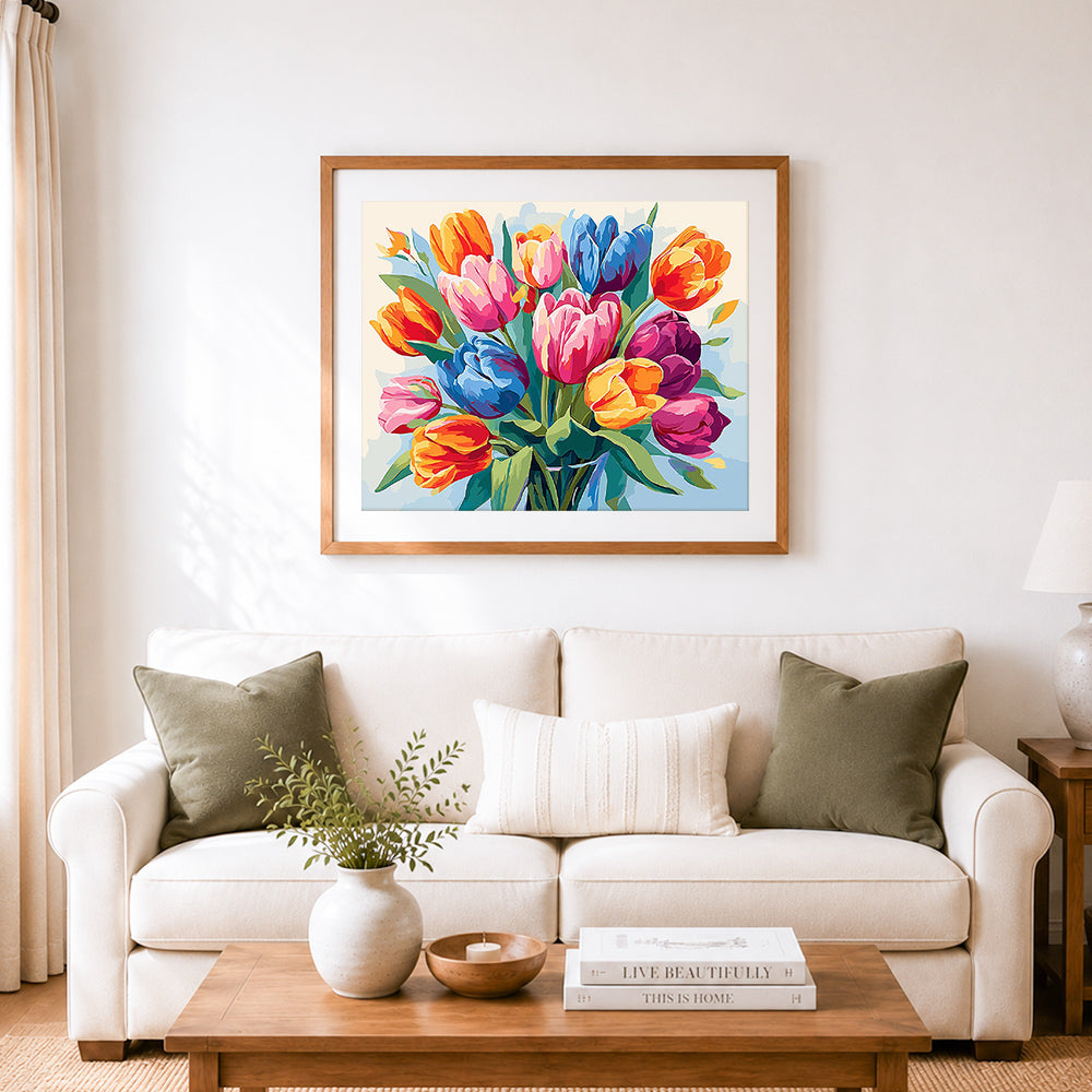 Finished vibrant tulip bouquet cross stitch artwork displayed as home decor