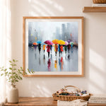 Finished vibrant umbrellas on a rainy street cross stitch artwork displayed as home decor