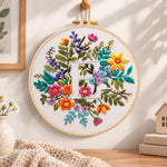 Vibrant wildflowers and letter e embroidery hoop wall art displayed as warm and cozy handmade home decor