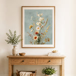 Finished vintage dried wildflower bouquet cross stitch artwork displayed as home decor