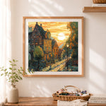 Finished vintage european town cross stitch artwork displayed as home decor
