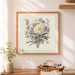 Finished vintage peony bouquet cross stitch artwork displayed as home decor