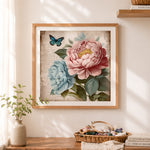 Finished vintage peony with blue butterfly cross stitch artwork displayed as home decor