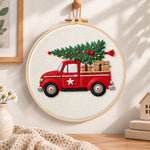 Vintage red christmas truck embroidery hoop wall art displayed as warm and cozy handmade home decor