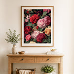 Finished vintage rose blooms cross stitch artwork displayed as home decor
