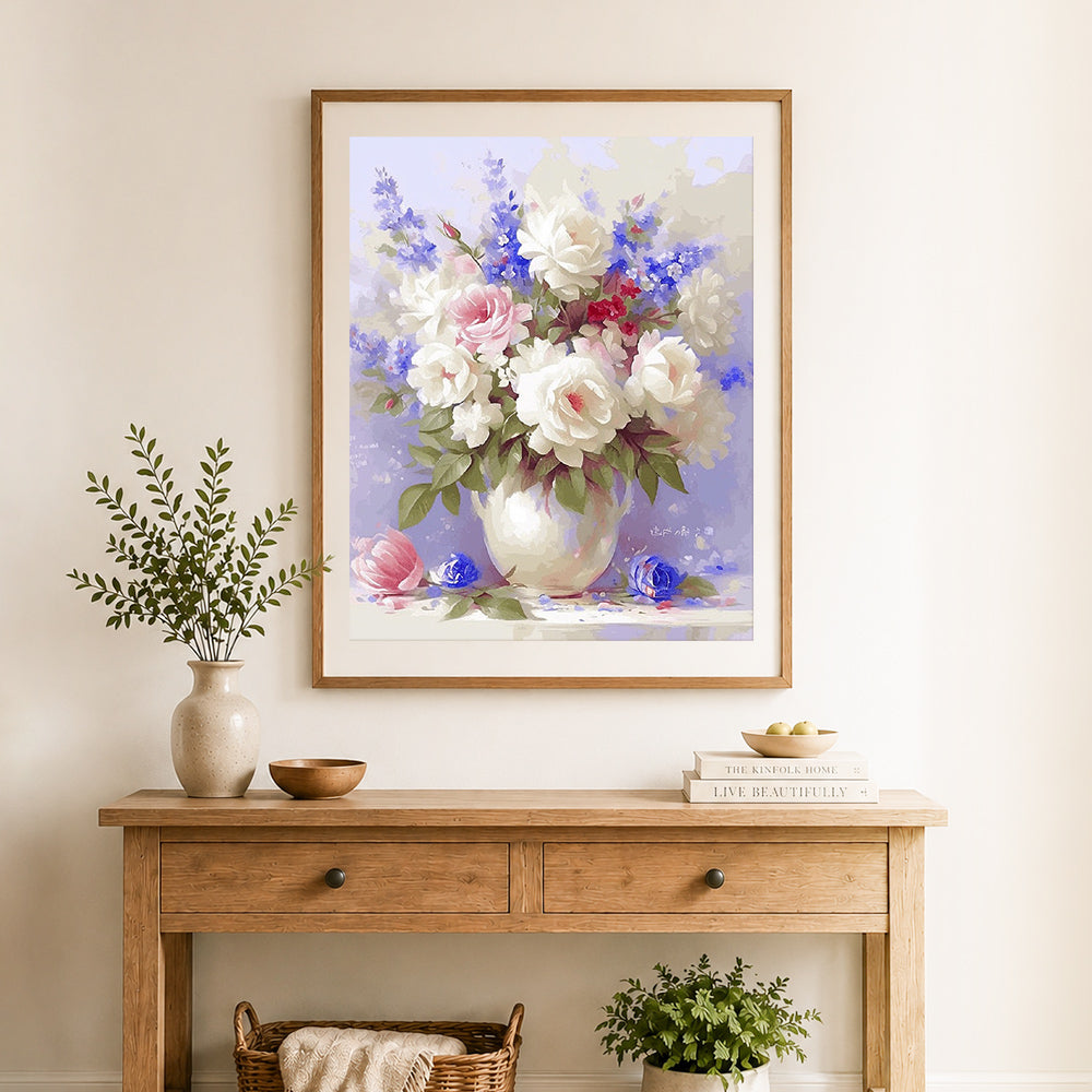 Finished vintage rose bouquet cross stitch artwork displayed as home decor