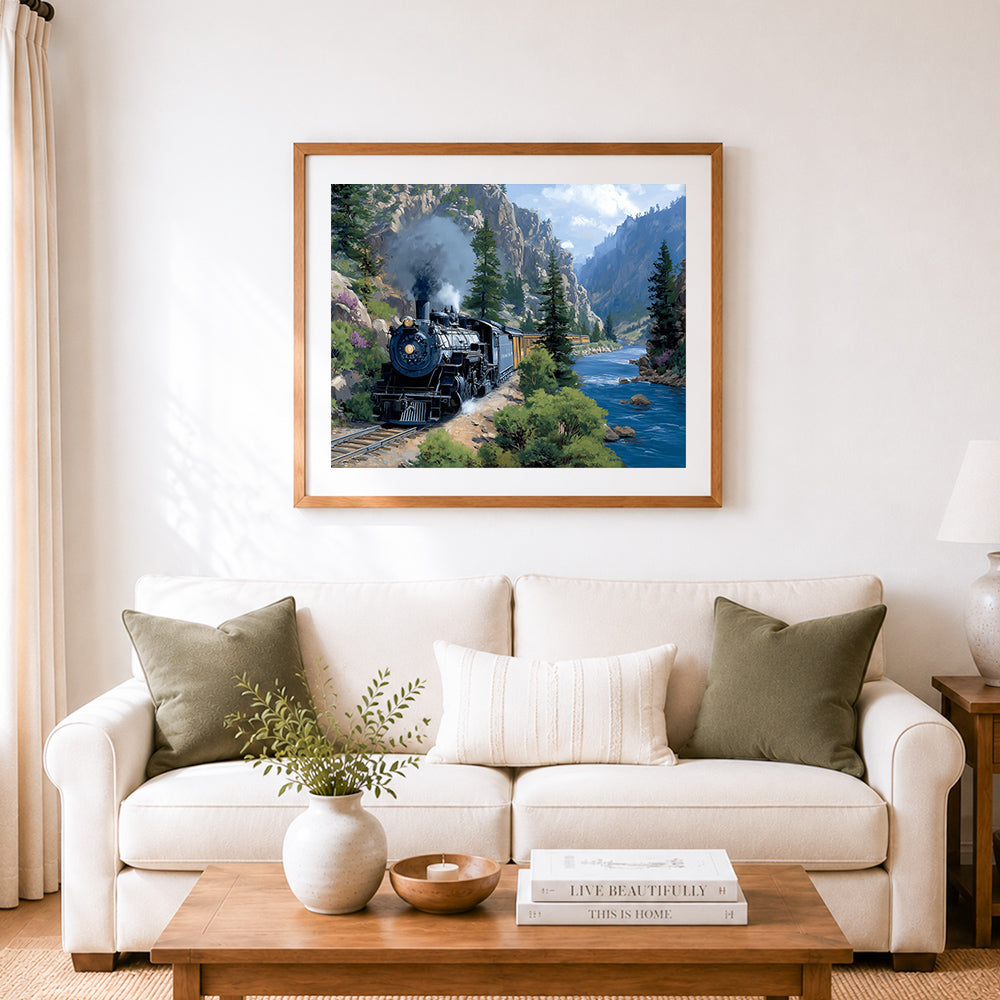 Finished vintage steam train through mountain canyon cross stitch artwork displayed as home decor