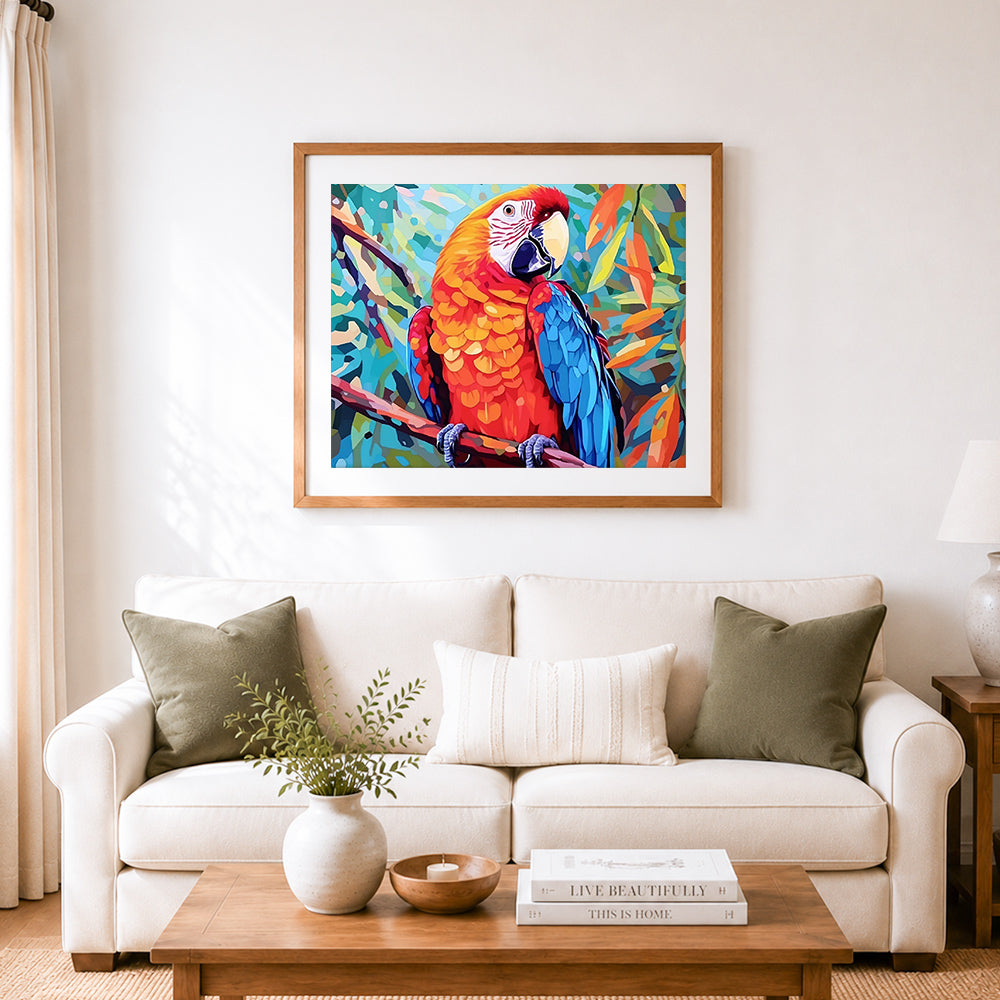 Finished vivid red and blue macaw cross stitch artwork displayed as home decor