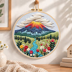 Volcanic mountain view embroidery hoop wall art displayed as warm and cozy handmade home decor