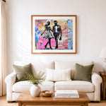 Finished walking lovers in graffiti art cross stitch artwork displayed as home decor