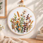 Warm tone dried florals embroidery hoop wall art displayed as warm and cozy handmade home decor