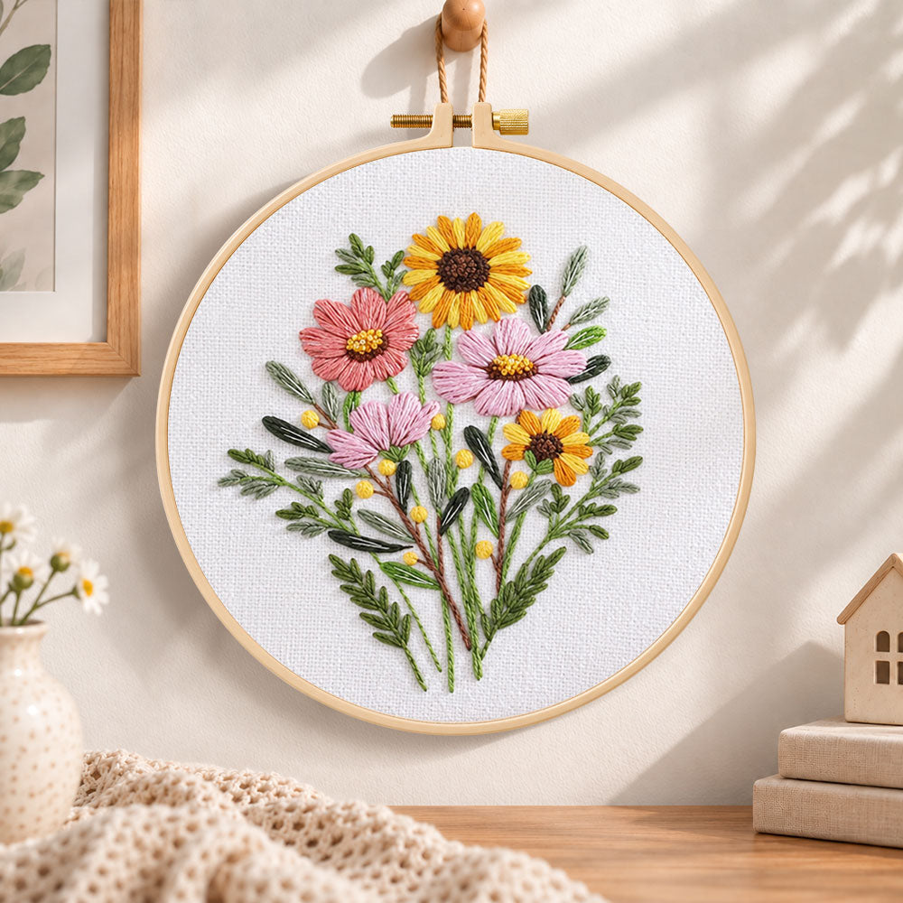 Warm‑toned posy embroidery hoop wall art displayed as warm and cozy handmade home decor