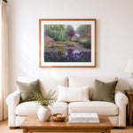 Finished water lily pond in a gentle garden cross stitch artwork displayed as home decor