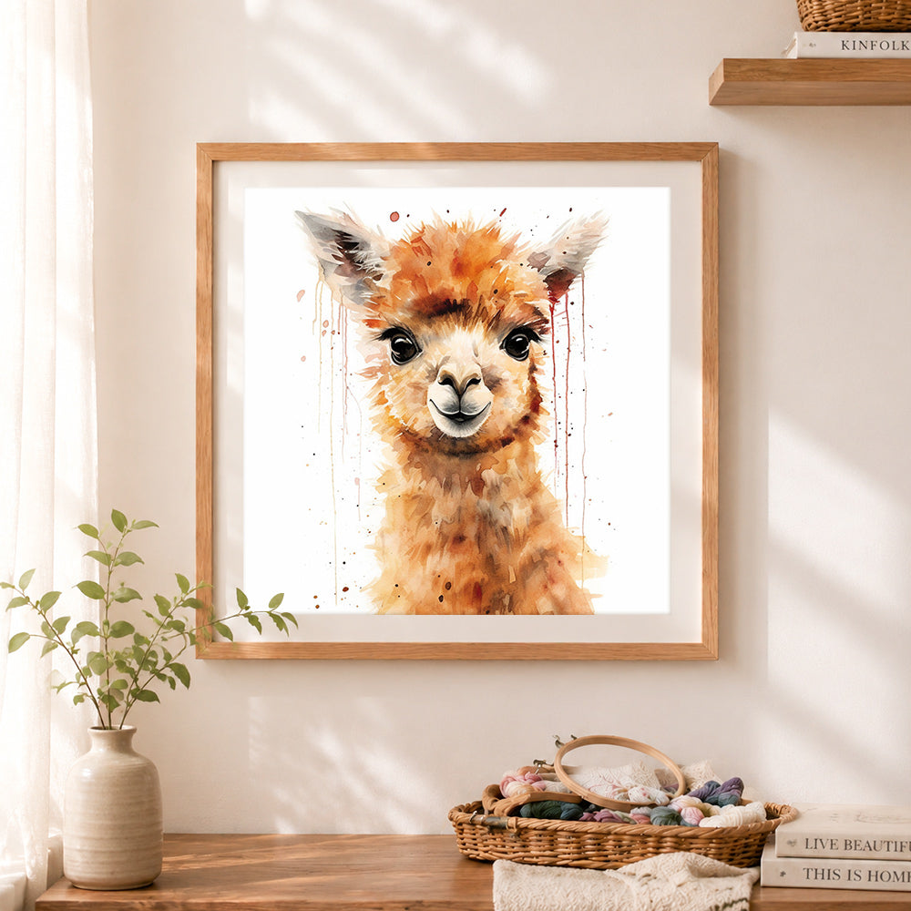 Finished watercolor alpaca cross stitch artwork displayed as home decor