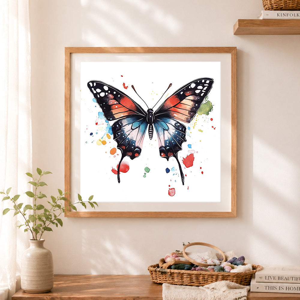 Finished watercolor butterfly cross stitch artwork displayed as home decor