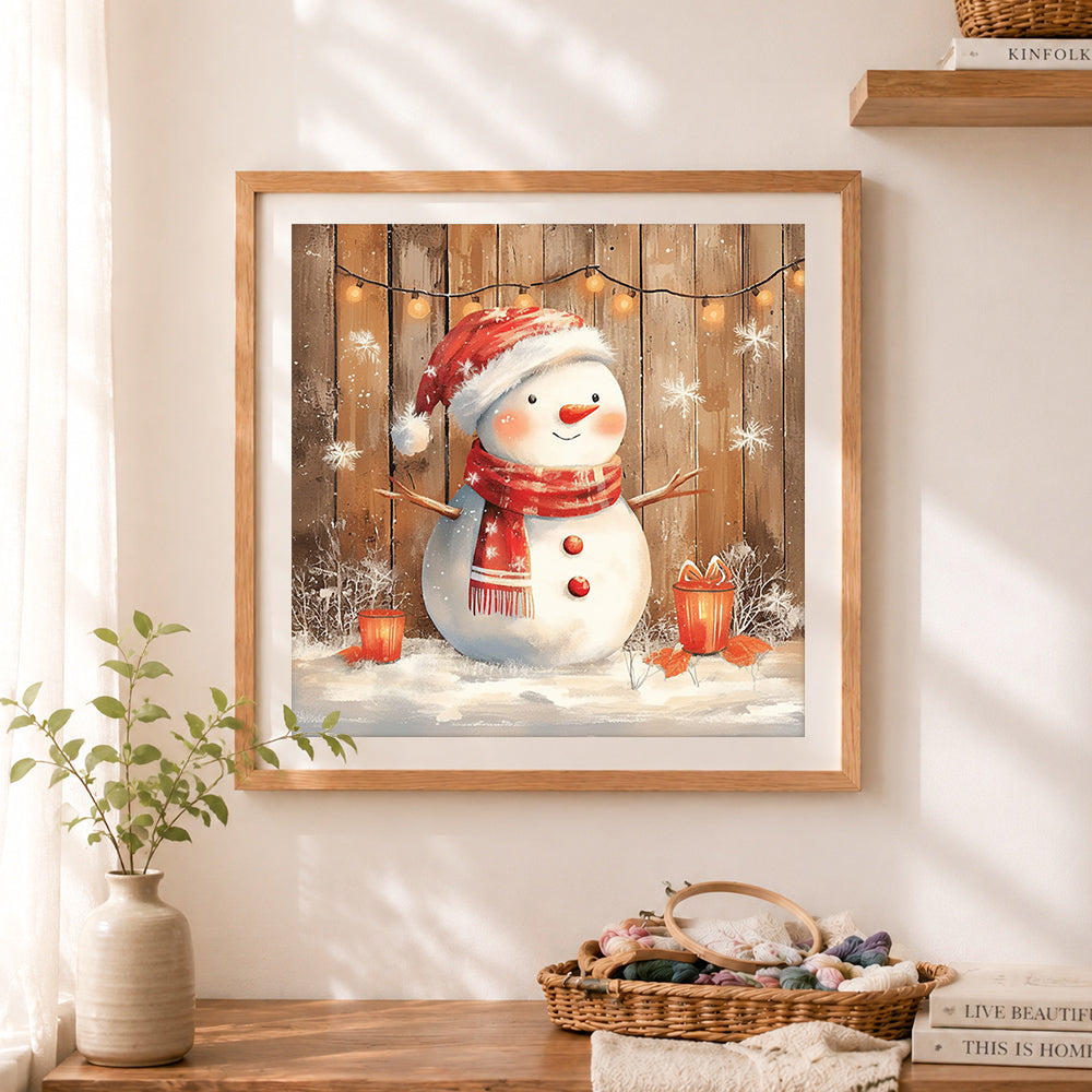 Finished watercolor christmas snowman cross stitch artwork displayed as home decor