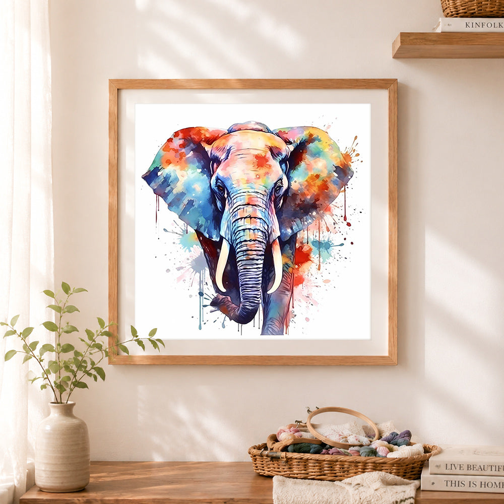 Finished watercolor elephant with splashes cross stitch artwork displayed as home decor