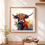 Finished watercolor highland cow with foliage cross stitch artwork displayed as home decor