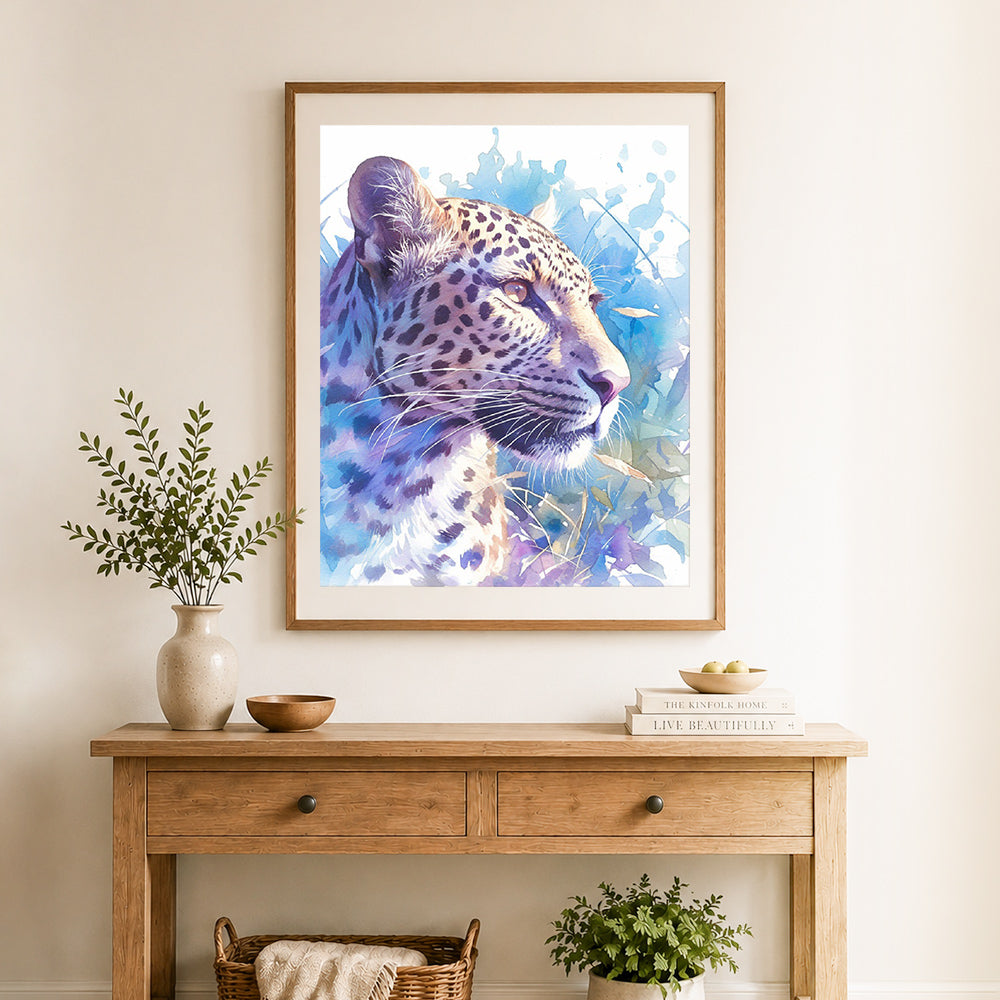 Finished watercolor leopard portrait cross stitch artwork displayed as home decor