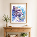 Finished watercolor leopard portrait cross stitch artwork displayed as home decor