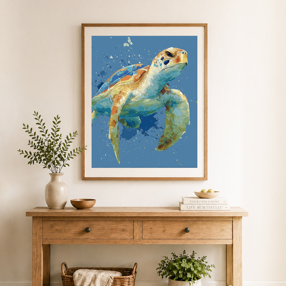 Finished watercolor sea turtle cross stitch artwork displayed as home decor