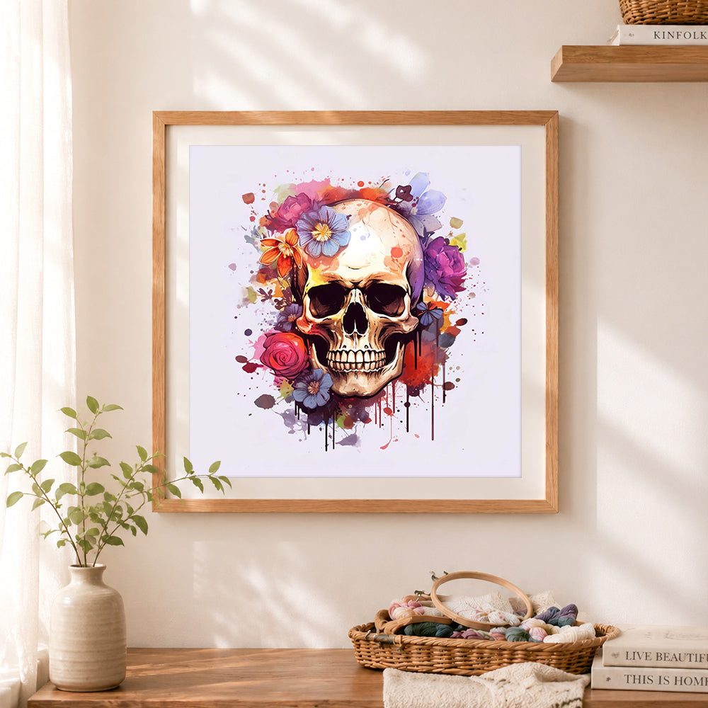 Finished watercolor splash flower skull cross stitch artwork displayed as home decor