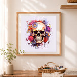 Finished watercolor splash flower skull cross stitch artwork displayed as home decor