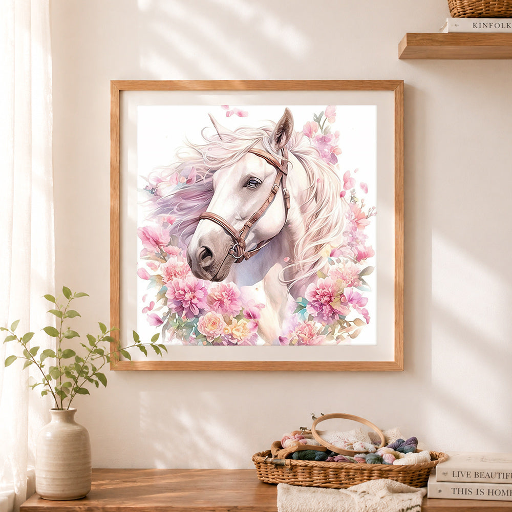 Finished watercolor white horse surrounded by blooms cross stitch artwork displayed as home decor