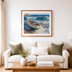 Finished weathered light blue rowboat on sandy beach cross stitch artwork displayed as home decor