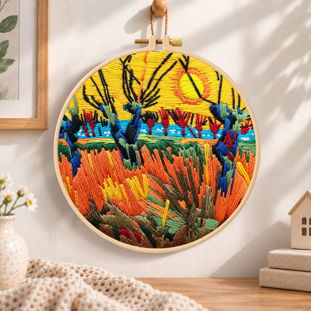 Wetland sunset scenery embroidery hoop wall art displayed as warm and cozy handmade home decor