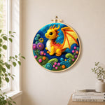 Whimsical baby dragon and colorful spiral plant needle felt wall art displayed in a bright home interior