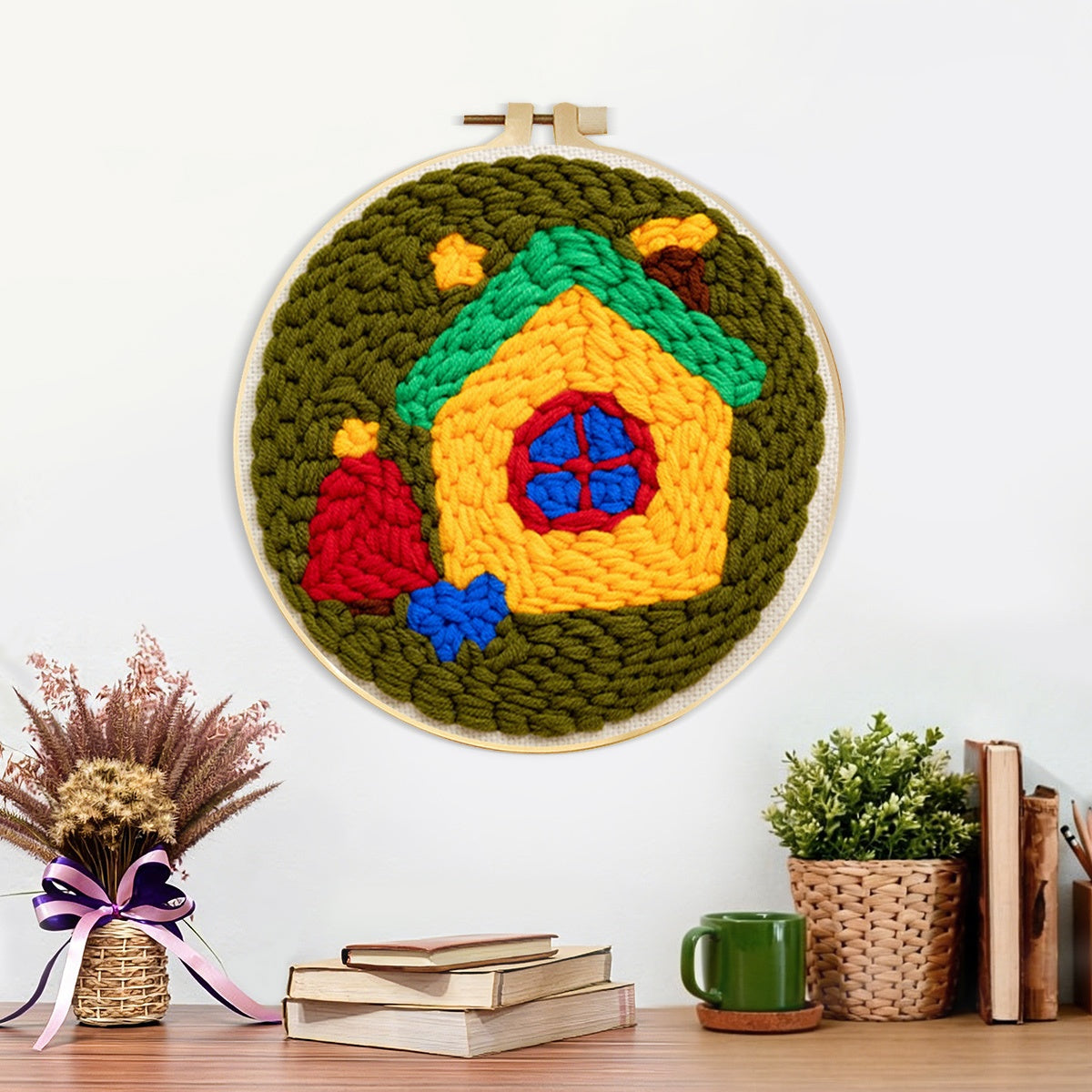 Finished whimsical fairy house artwork displayed on a wall