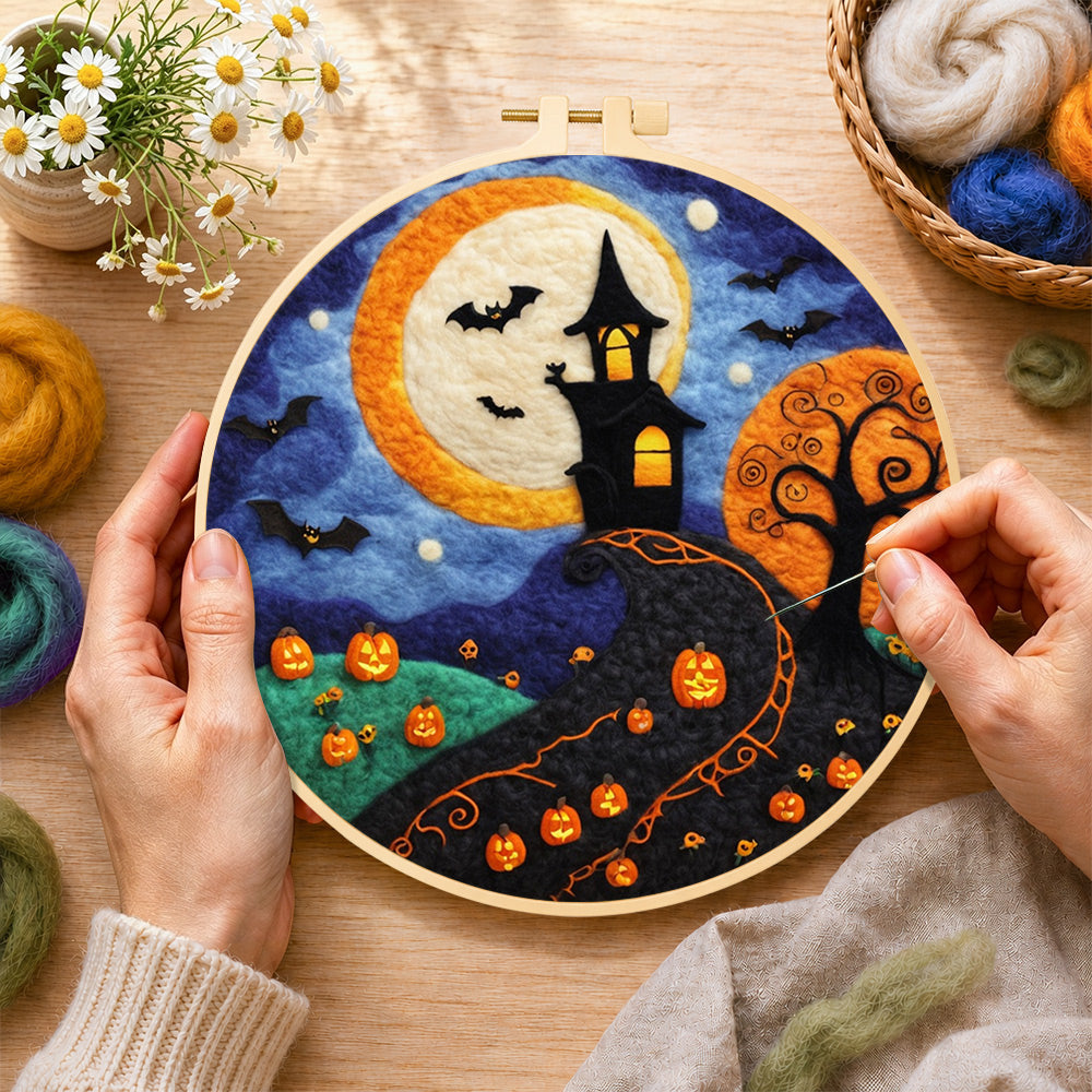 Creating the whimsical haunted village and halloween pumpkins wool painting by hand with a felting needle