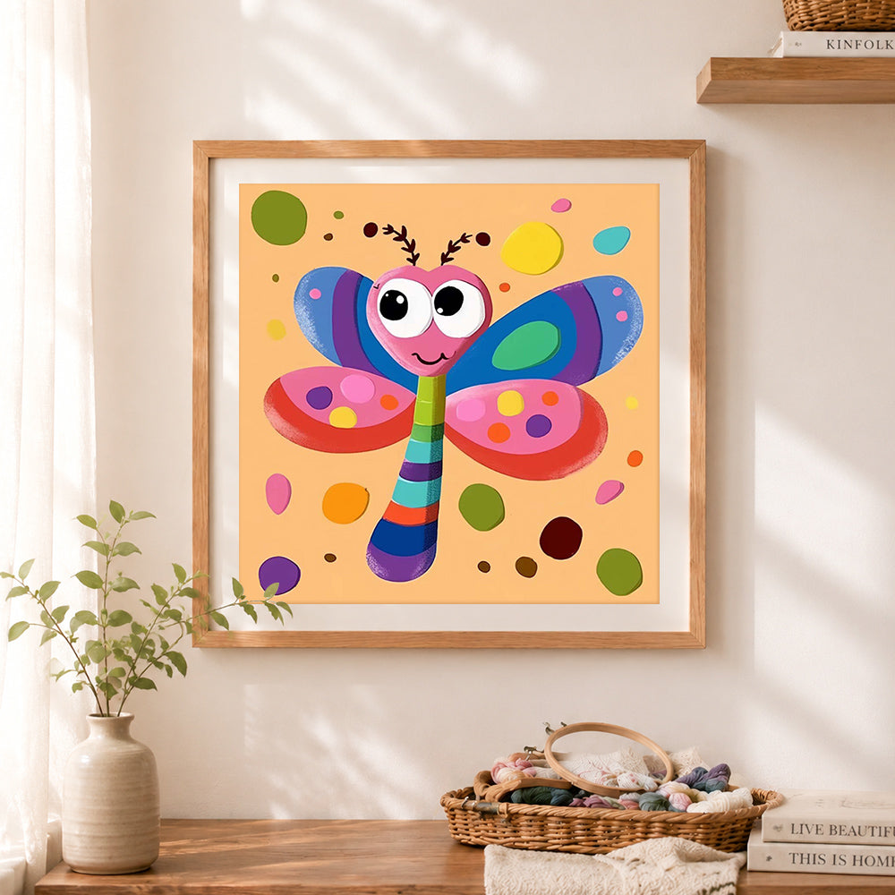 Finished whimsical rainbow dragonfly cross stitch artwork displayed as home decor