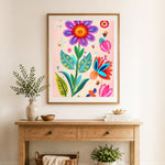 Finished whimsical spring floral cross stitch artwork displayed as home decor