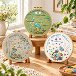Whimsical stitching creation embroidery kit finished hoop displayed on a wooden stand as cozy tabletop decor