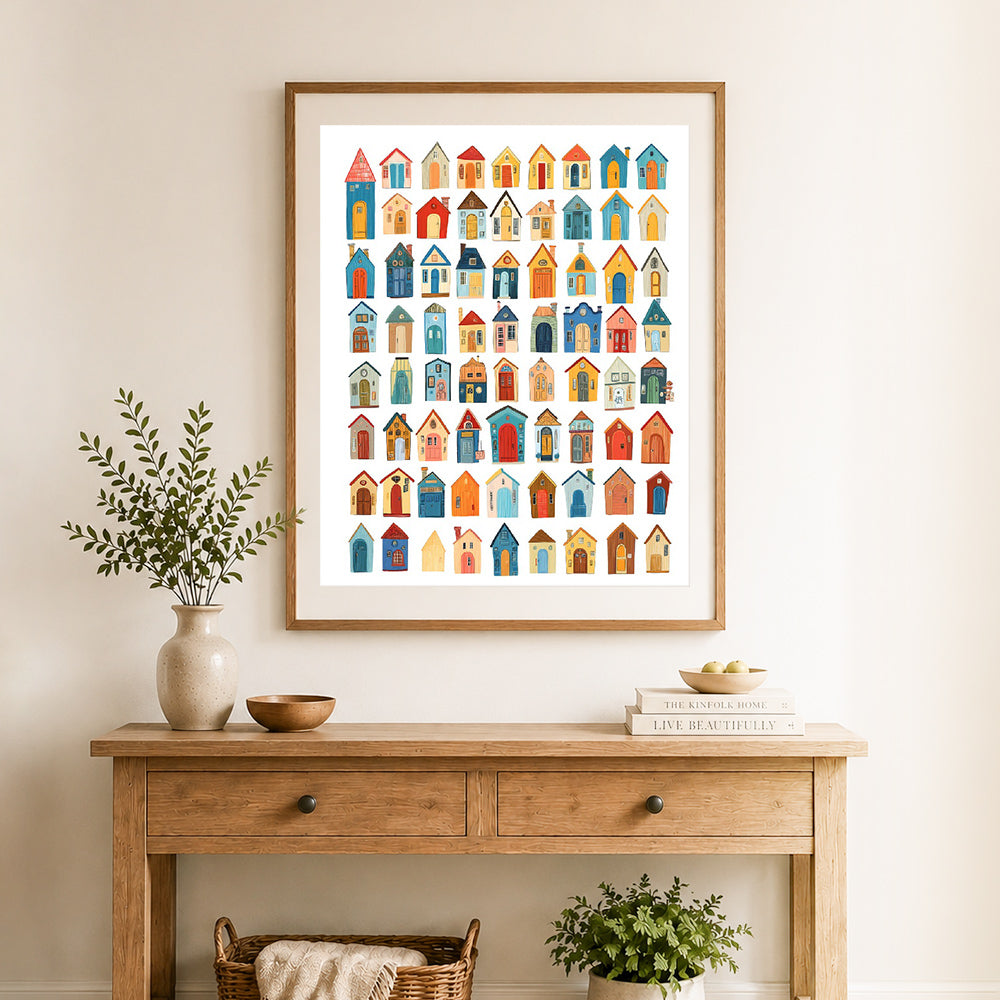 Finished whimsical tiny houses cross stitch artwork displayed as home decor