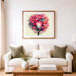Finished whimsical watercolor blossom tree cross stitch artwork displayed as home decor