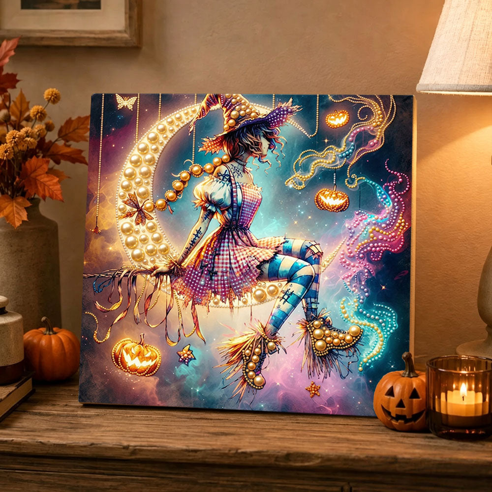 Finished whimsical witch on moon pearl diamond painting artwork displayed as holiday home decor