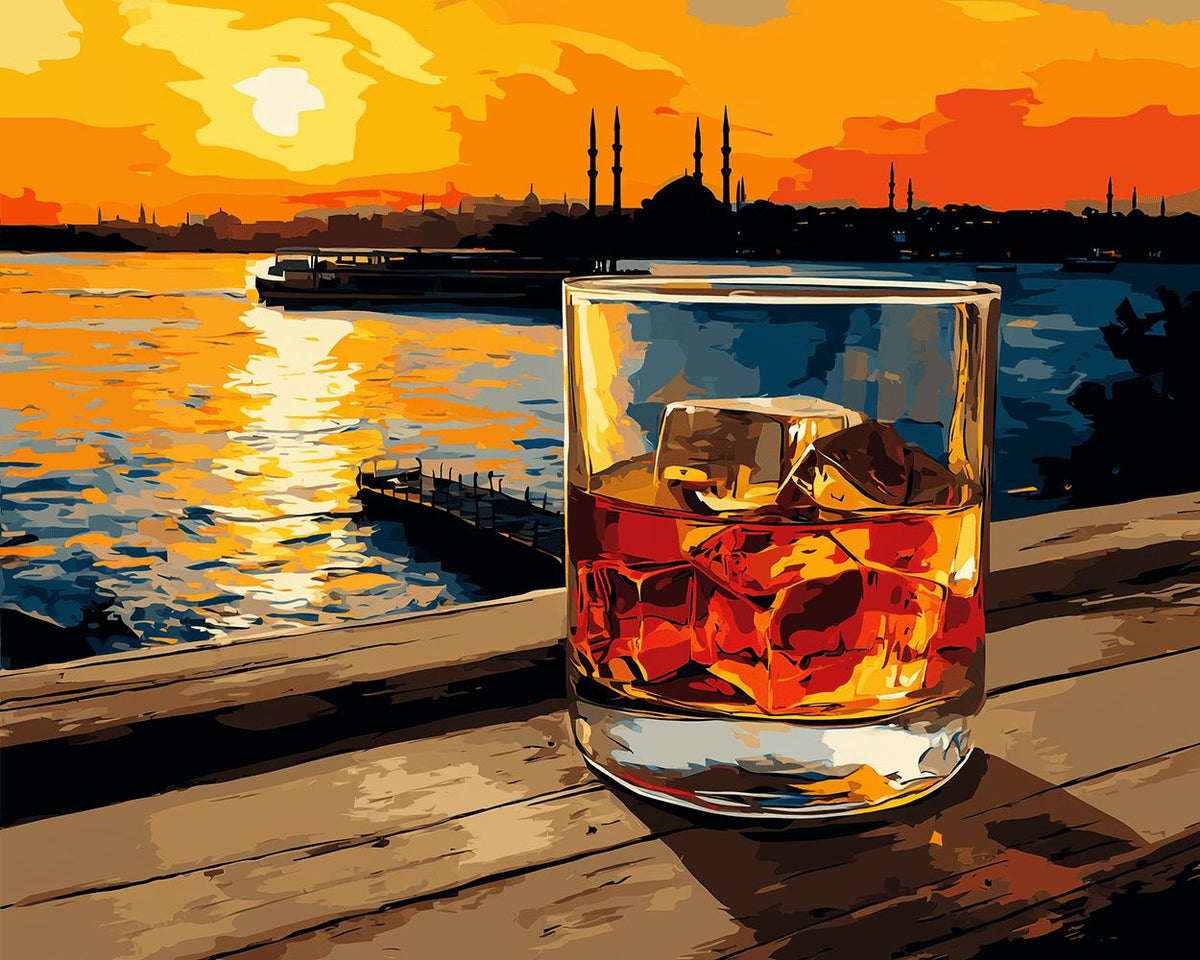 Whiskey glass on wooden pier at sunset cross stitch kit for beginners