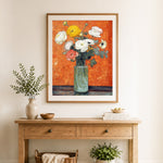Finished white and yellow ranunculus in glass vase cross stitch artwork displayed as home decor