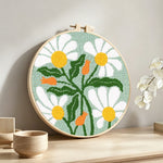 White chamomile punch needle artwork displayed on a table