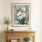 Finished white cherry blossom branch cross stitch artwork displayed as home decor