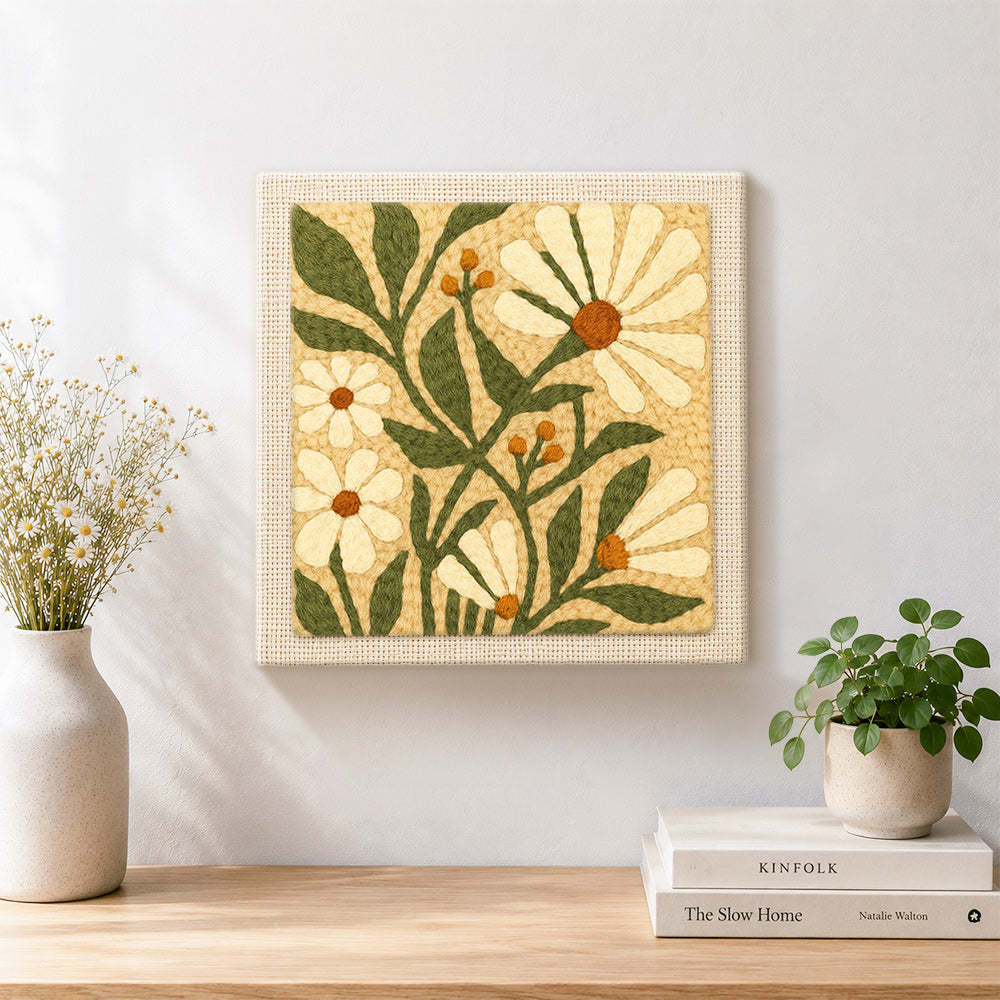 Finished white daisies and berries artwork displayed on a wall